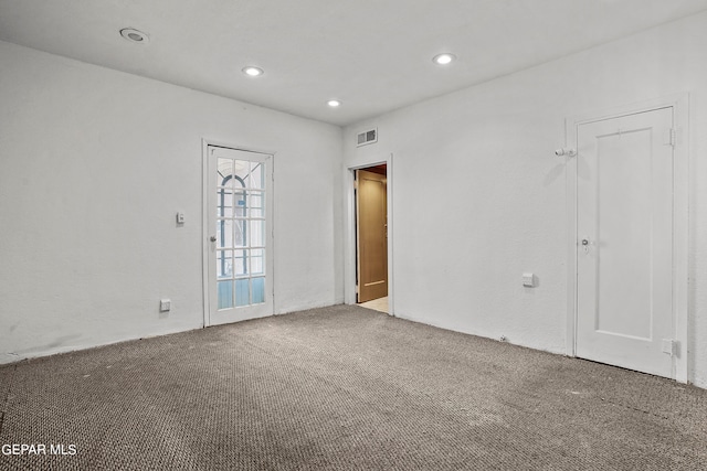 unfurnished room featuring carpet flooring