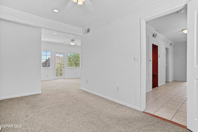 empty room with ornamental molding, ceiling fan, and light colored carpet