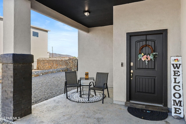 doorway to property featuring a patio area