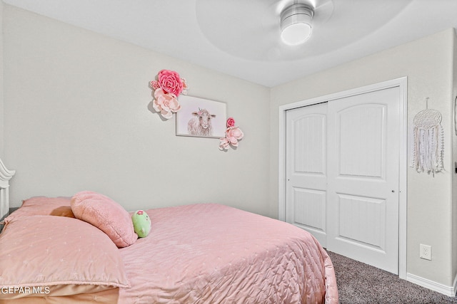 bedroom with ceiling fan, carpet floors, and a closet