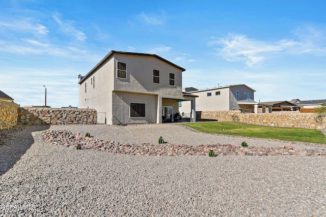 back of property featuring a patio area