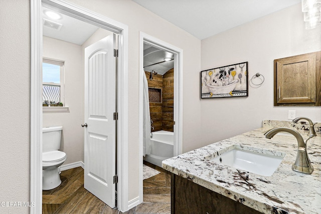 full bathroom with vanity, toilet, shower / bathtub combination with curtain, and hardwood / wood-style flooring