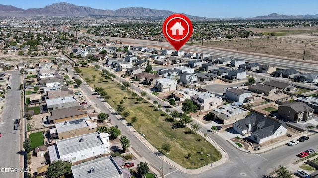 birds eye view of property featuring a mountain view