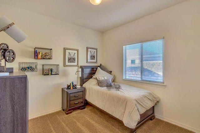 bedroom with light colored carpet