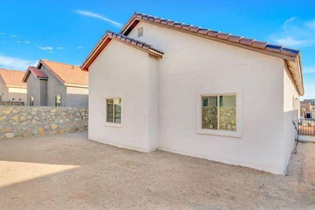 13618 Doncaster St, Horizon City, TX 79928 - rear view of house featuring stucco siding and fence