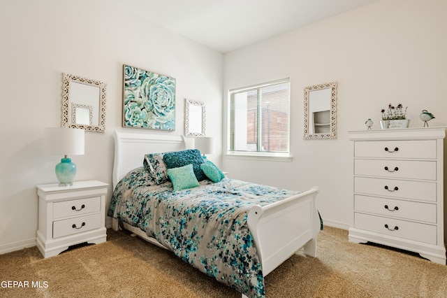 bedroom featuring light carpet