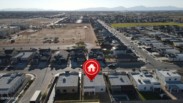 birds eye view of property featuring a mountain view