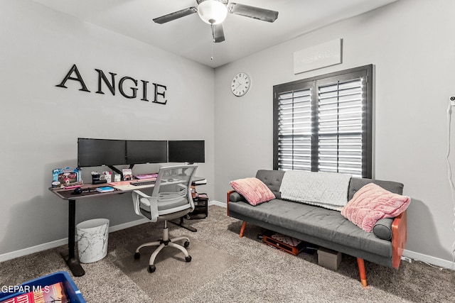 carpeted home office featuring ceiling fan