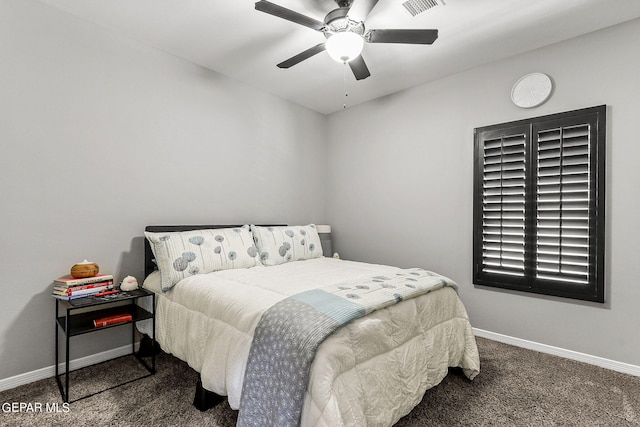 bedroom with dark colored carpet and ceiling fan