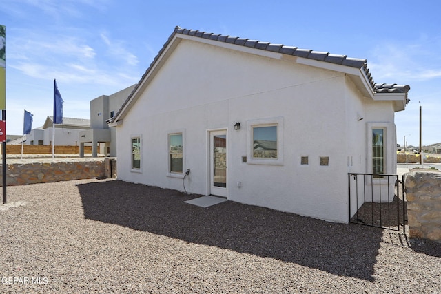 rear view of property featuring a patio area