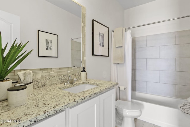 full bathroom featuring shower / tub combo, vanity, toilet, and tasteful backsplash