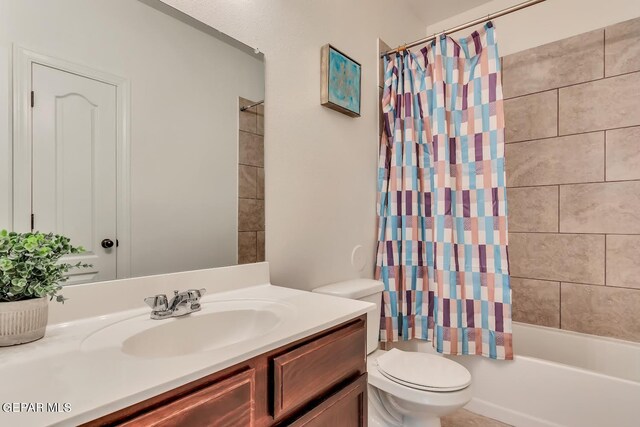 full bathroom featuring vanity, shower / tub combo, and toilet