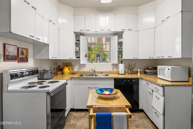 kitchen featuring white appliances, white cabinetry, sink, and butcher block counters