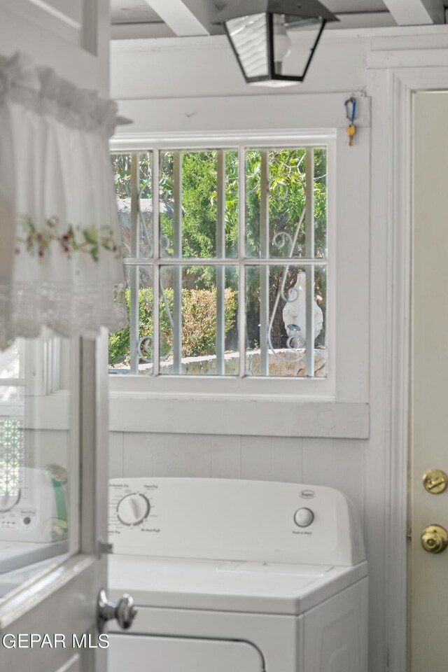 bathroom featuring a healthy amount of sunlight and washer / clothes dryer