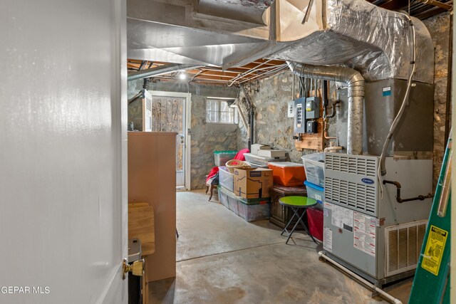 basement featuring heating unit