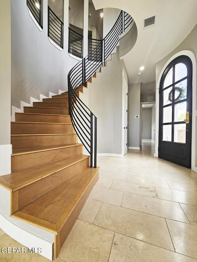 foyer entrance with a high ceiling