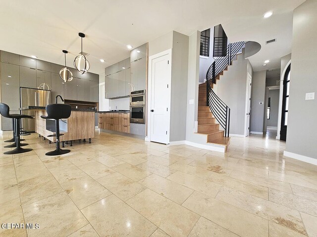 kitchen featuring hanging light fixtures and double oven