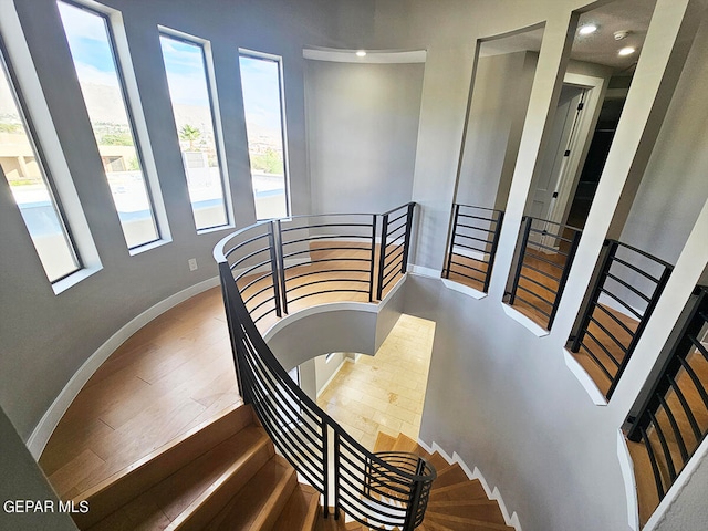 stairs featuring wood-type flooring