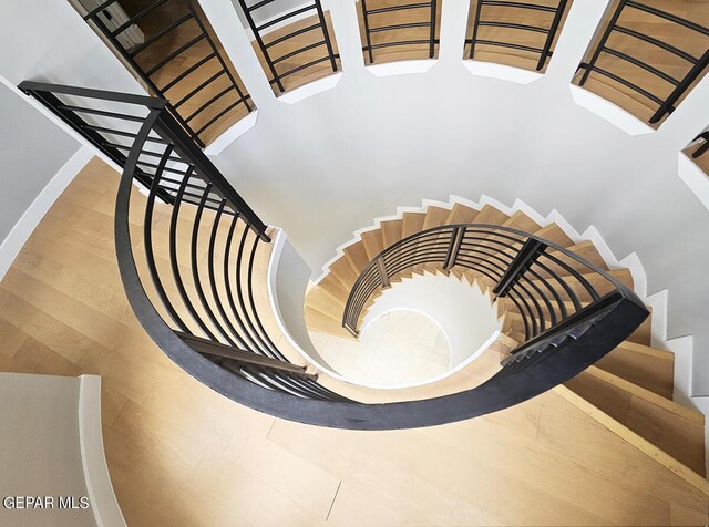 stairs featuring brick ceiling