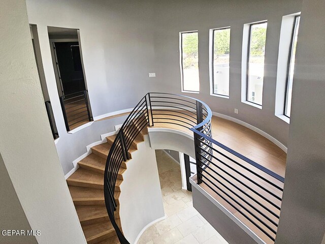 stairs with tile patterned flooring