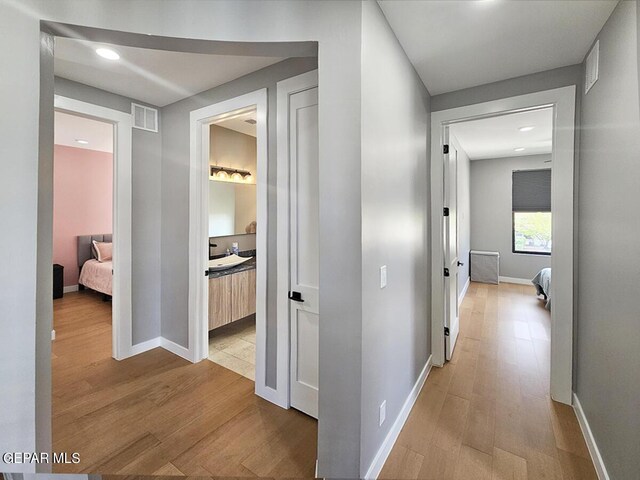 hallway featuring light wood-type flooring