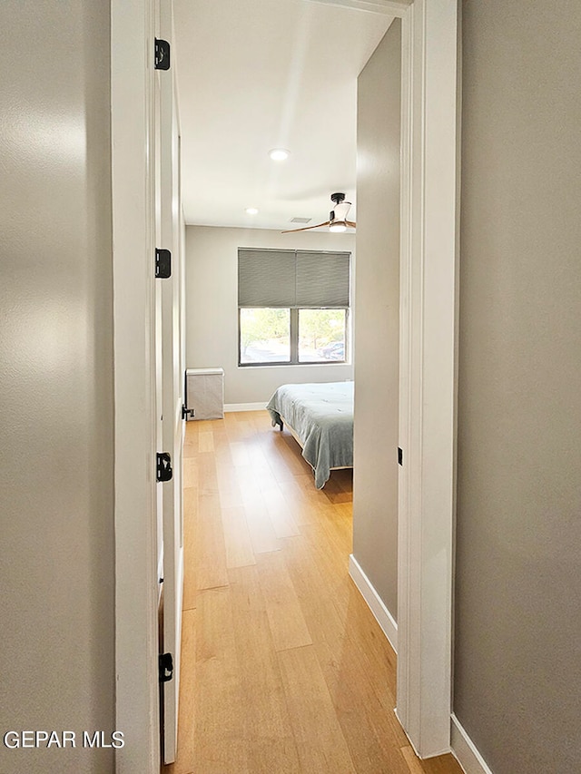 corridor featuring light hardwood / wood-style floors