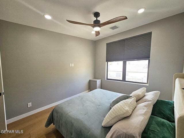 bedroom featuring ceiling fan and hardwood / wood-style flooring