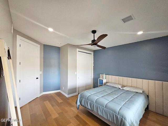 bedroom featuring light wood-type flooring and ceiling fan