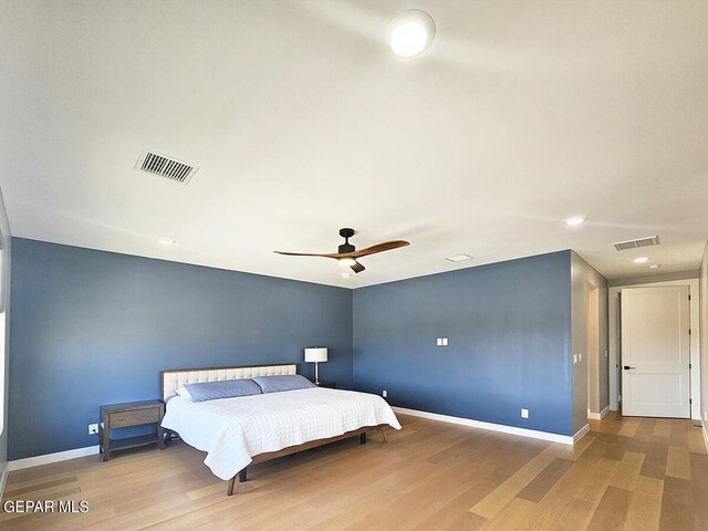 bedroom featuring hardwood / wood-style flooring and ceiling fan