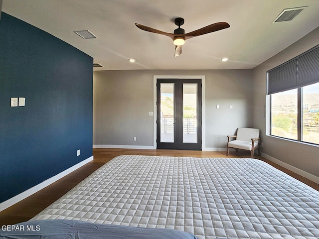 bedroom featuring hardwood / wood-style flooring, ceiling fan, access to outside, and french doors