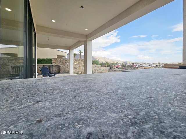 view of patio / terrace with a mountain view