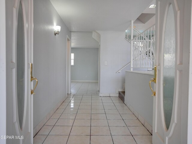 interior space featuring light tile patterned flooring