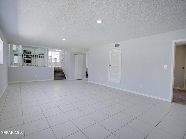 interior space featuring a textured ceiling