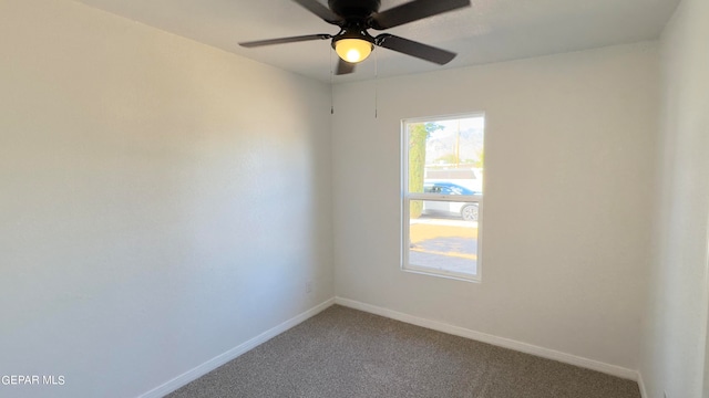 spare room featuring carpet flooring and ceiling fan