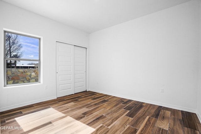 unfurnished bedroom with a closet