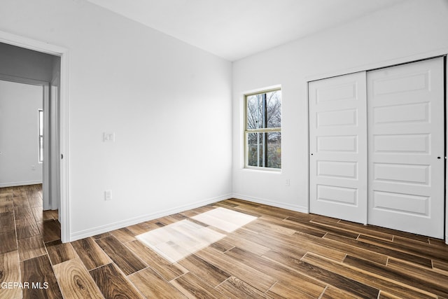 unfurnished bedroom with a closet