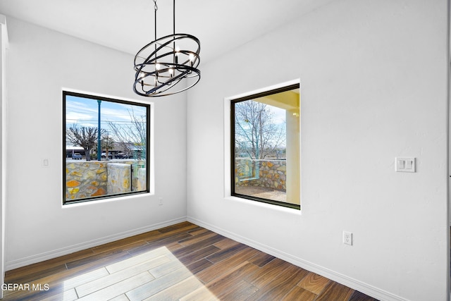 spare room featuring a notable chandelier