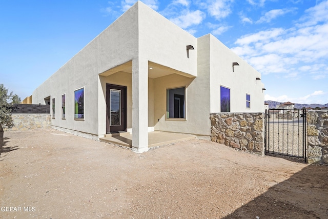 rear view of house featuring a patio area