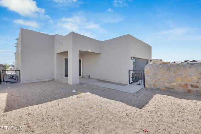 back of property featuring a patio area