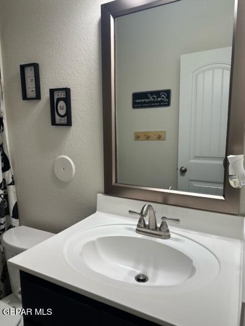 bathroom with vanity and toilet