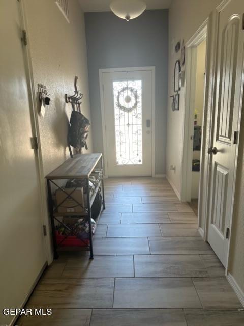 entryway with light hardwood / wood-style floors