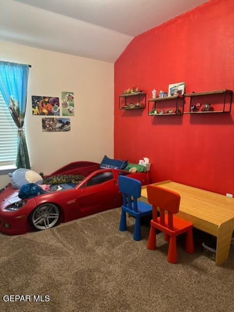 carpeted bedroom featuring lofted ceiling