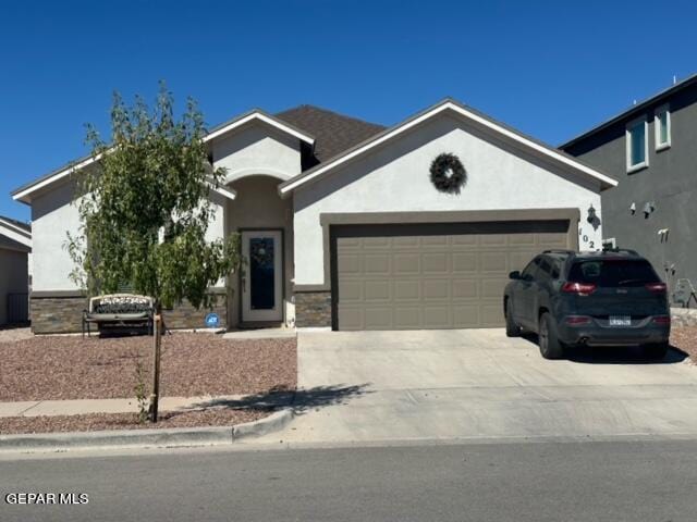 view of front of property with a garage