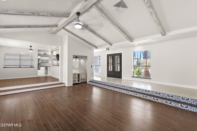 unfurnished living room with lofted ceiling with beams, ceiling fan, and hardwood / wood-style floors