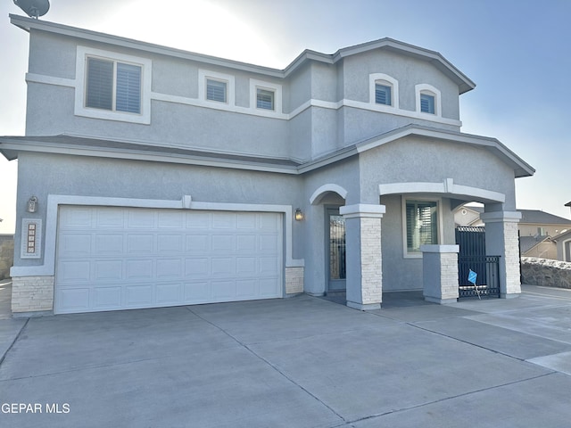 view of front of property with a garage and covered porch