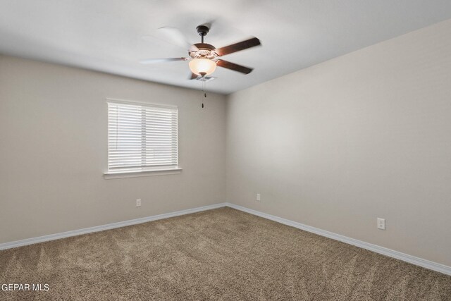 spare room with ceiling fan and carpet flooring