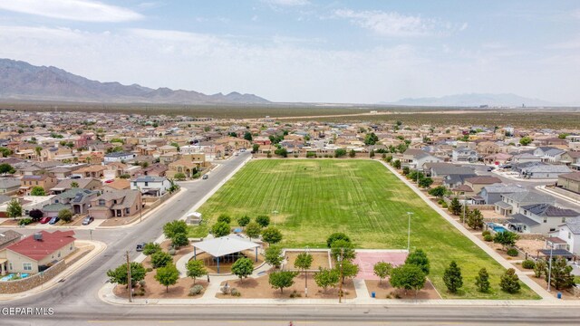 birds eye view of property with a mountain view