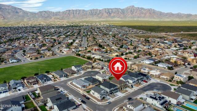 birds eye view of property featuring a mountain view