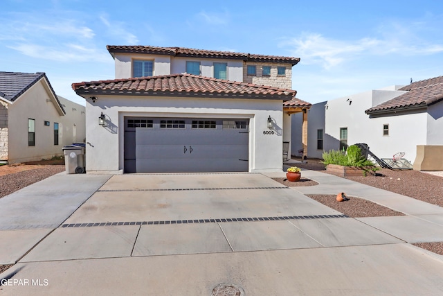 mediterranean / spanish house with a garage