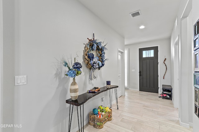 entryway with light hardwood / wood-style flooring